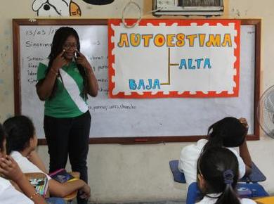 Damaris Guaza Sandoval of Colombia facilitates a workshop on self-esteem for a class in Honduras